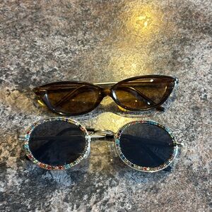 Two pairs of sunglasses.